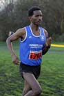 Eritrean athlete Weynay Ghebresilasie running for Sunderland Harriers on his way to third place in the Start First North East Harrier League, Jarrow.